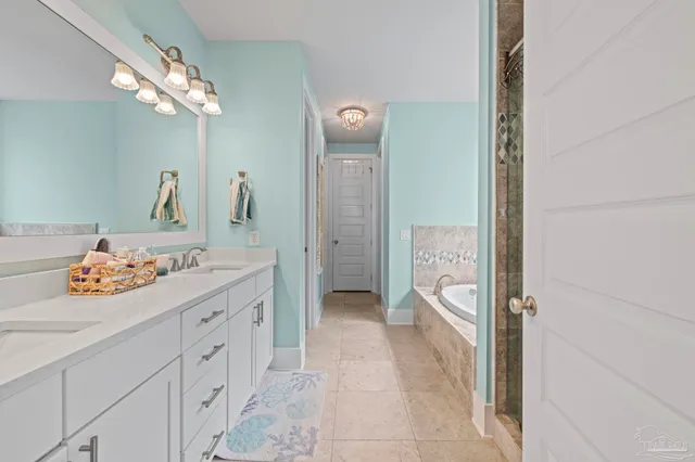 a view of a house with a yard and garage