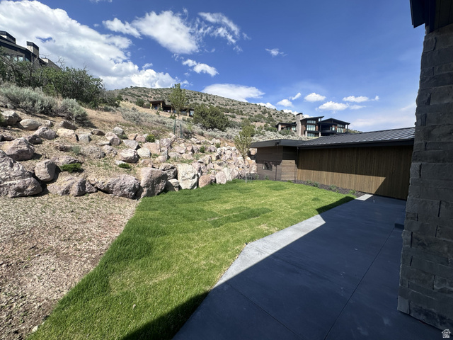 1918 Chimney Rock Road Heber City, UT 84032 - Photo 11 of 74 Contemporary exterior featuring stone siding, wood paneling, and a dark metal roofline
