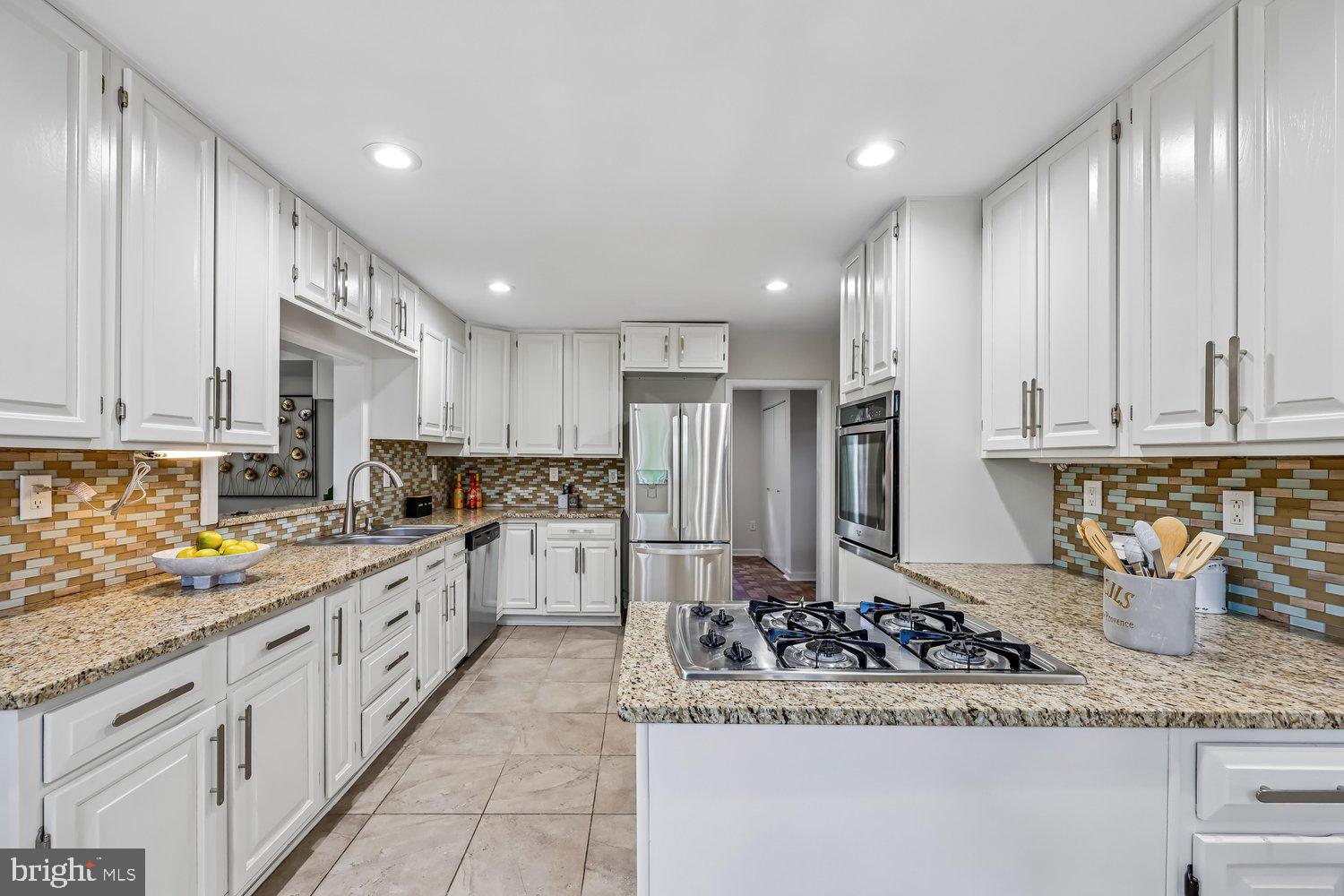 300 Gilsan Court Silver Spring, MD 20902 - Photo 46 of 117 a kitchen with a sink and refrigerator