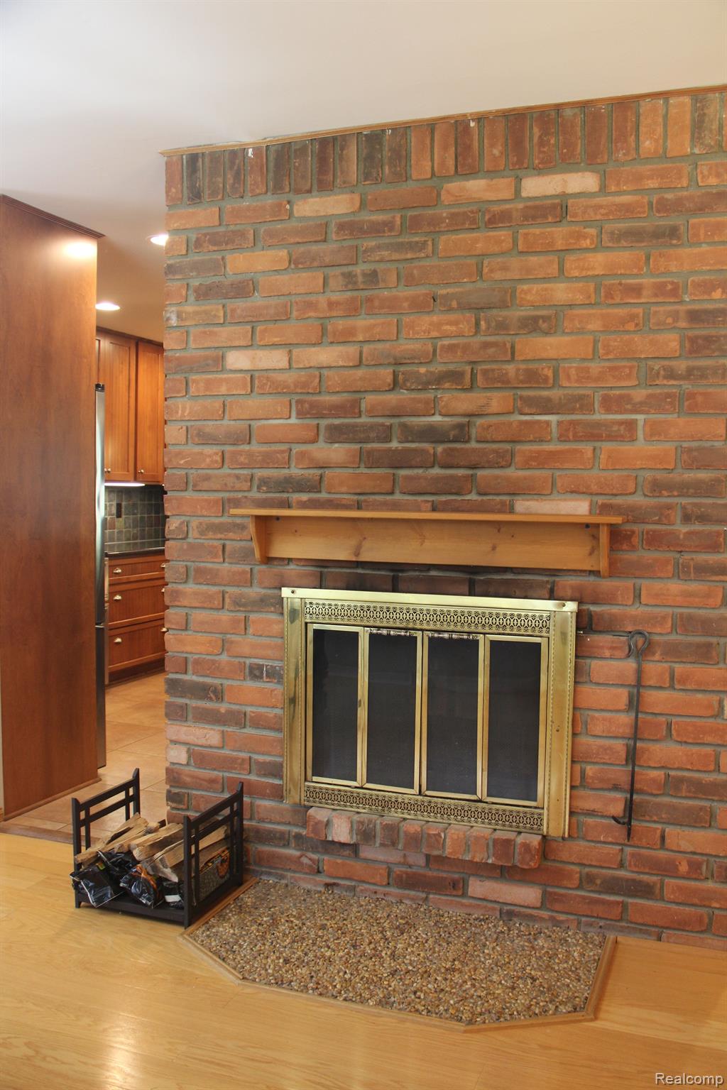 8087 East Carpenter Road Davison, MI 48423 - Photo 12 of 40 Double-sided, wood-burning, fireplace