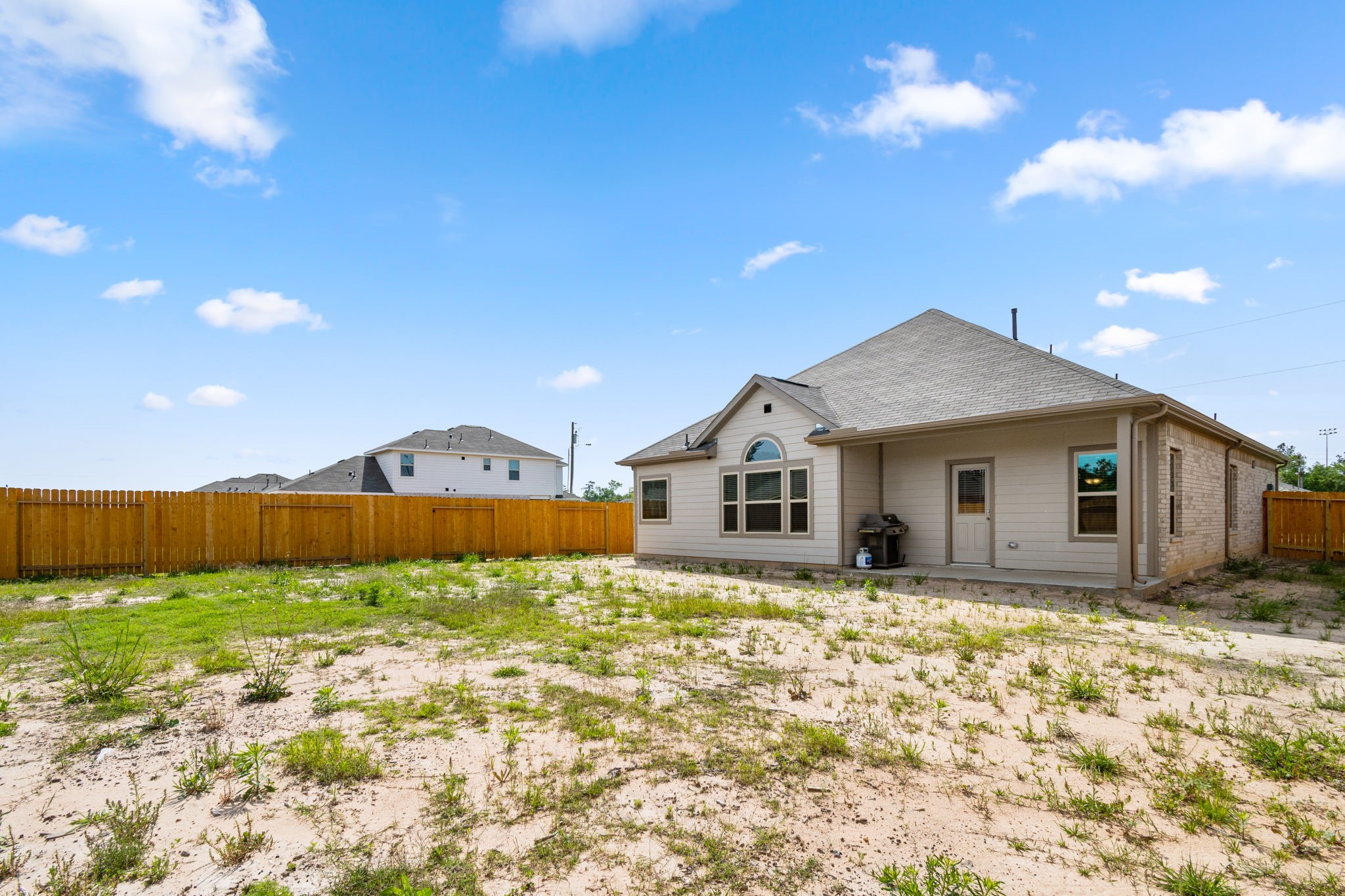 26019 Babe Ruth Drive Splendora, TX 77372 - Photo 21 of 23 a house with trees in the background