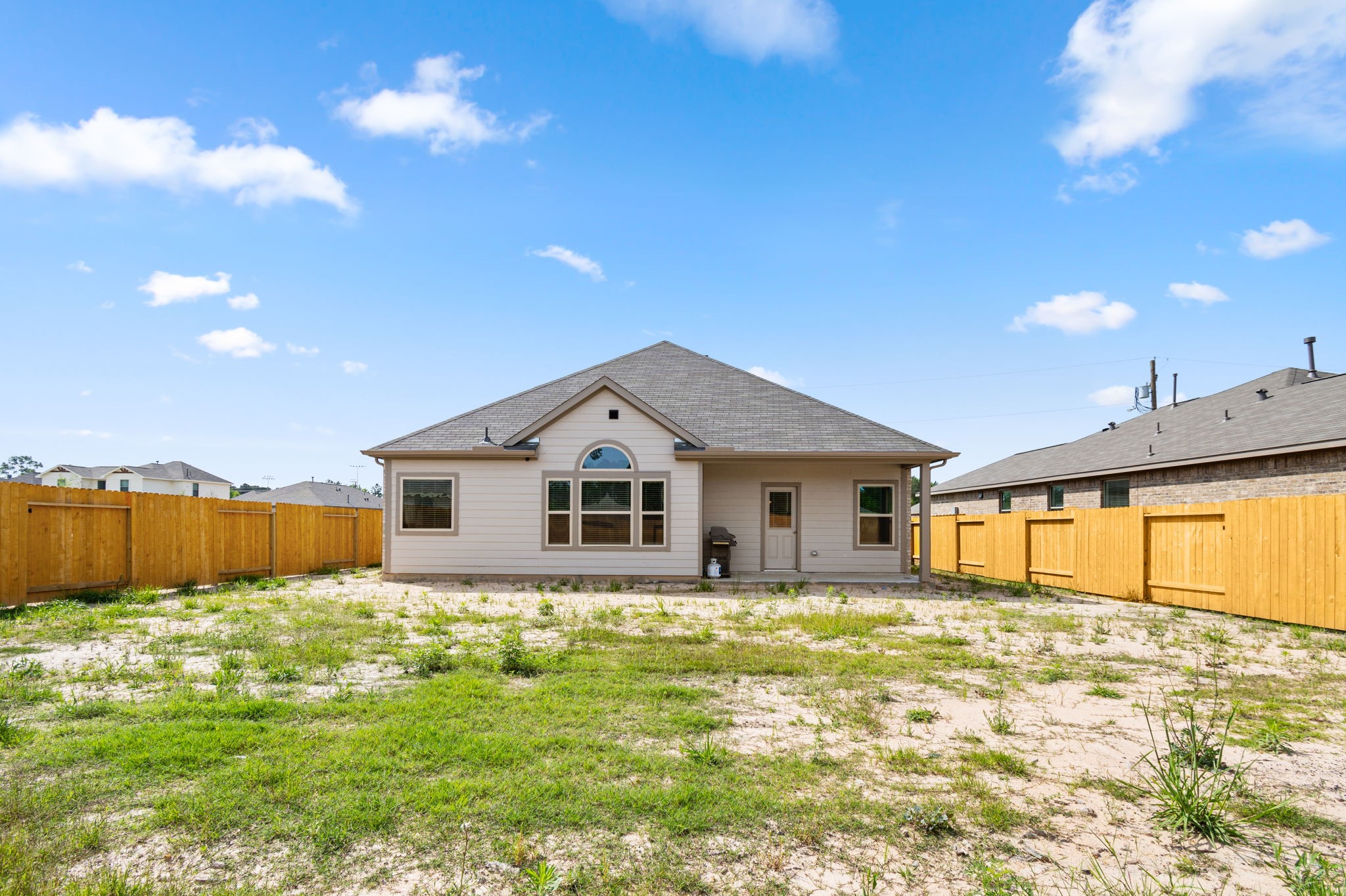 26019 Babe Ruth Drive Splendora, TX 77372 - Photo 22 of 23 a house with trees in the background