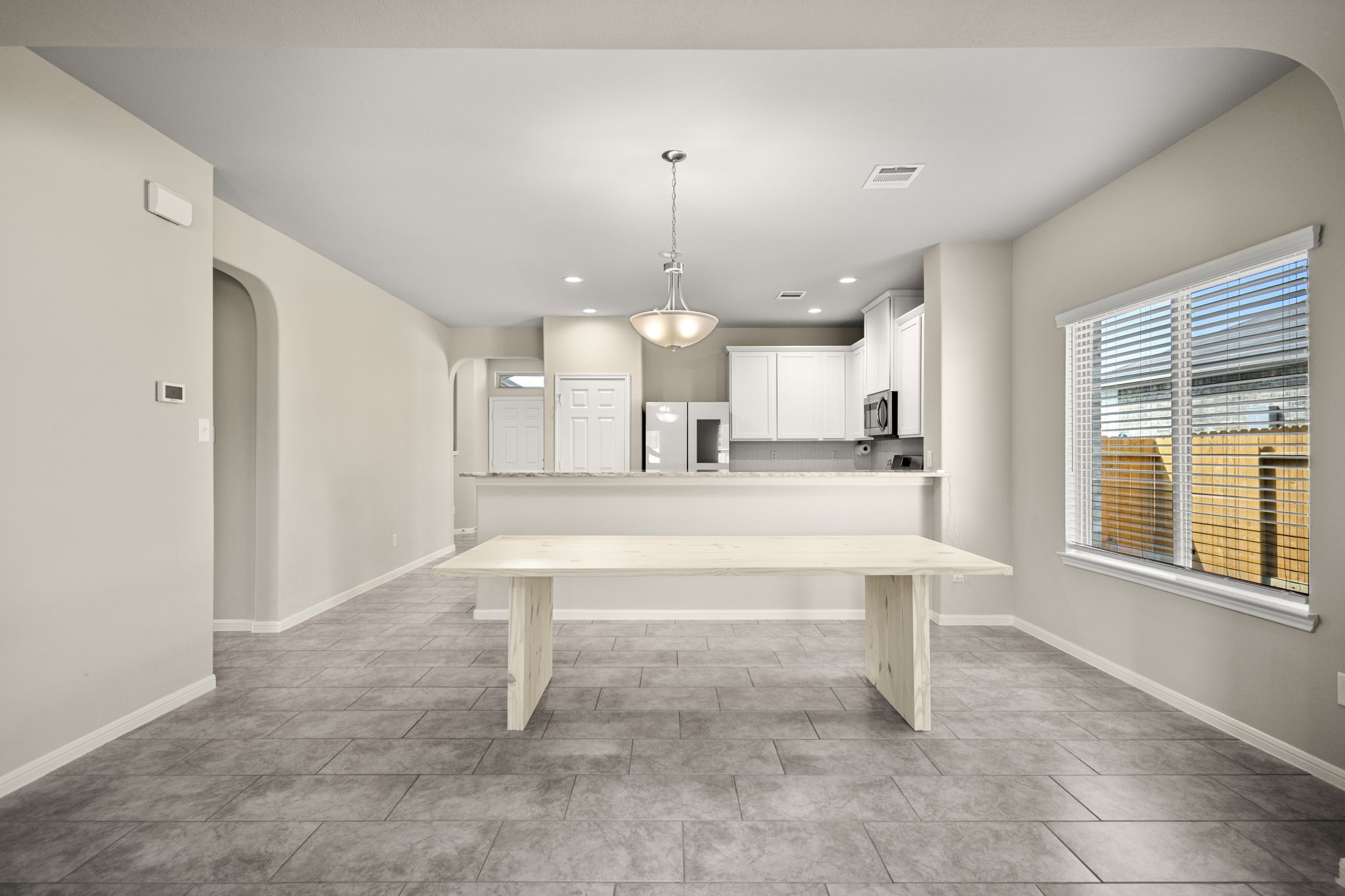 26019 Babe Ruth Drive Splendora, TX 77372 - Photo 10 of 23 a large white kitchen with a sink and dishwasher a refrigerator with wooden floor