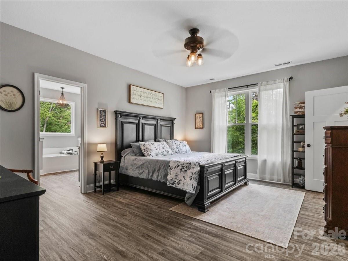 36 Cherry Ridge Lane Weaverville, NC 28787 - Photo 16 of 37 a bedroom with a bed and a chandelier