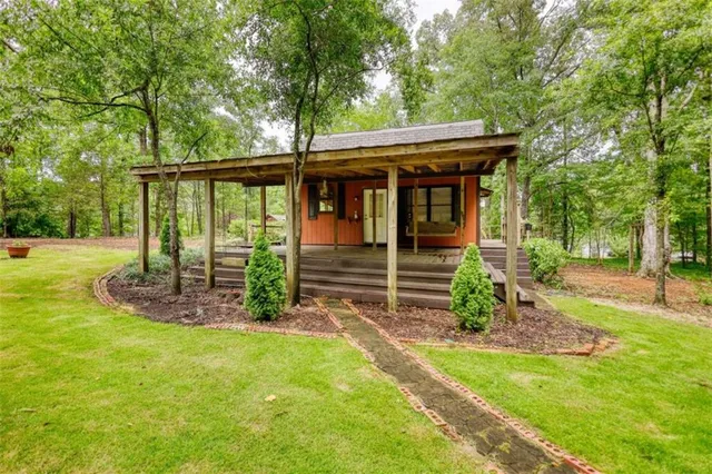 a front view of a house with garden