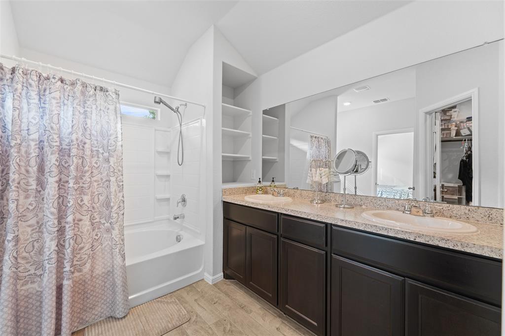 9020 Ridgeriver Way Fort Worth, TX 76131 - Photo 17 of 26 a bathroom with a granite countertop sink mirror and a bath tub