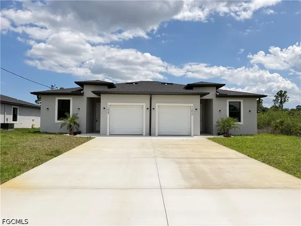 front view of a house with a yard