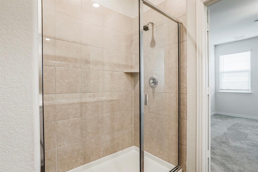 652 Ridgeback Trail Fort Worth, TX 76052 - Photo 16 of 20 Bathroom with an enclosed shower