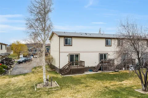 a view of a house with swimming pool and sitting area