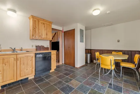 a kitchen with a sink cabinets and appliances