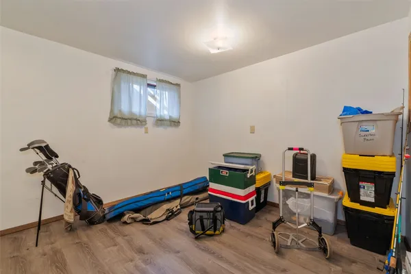 a room with furniture and a wooden floor