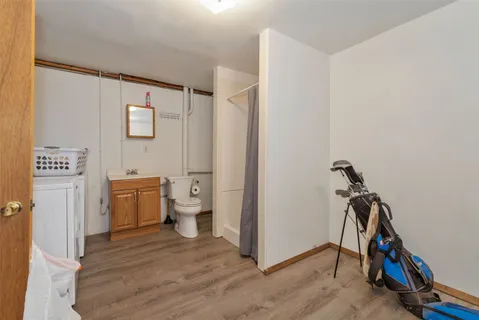 a view of a bathroom with sink dryer and washer