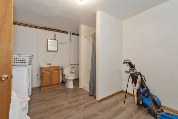 a view of a bathroom with sink dryer and washer