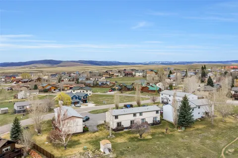 an aerial view of a house with a ocean view