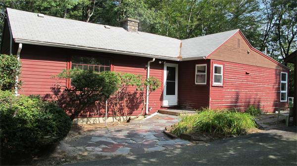 23 Patterson Road Lexington, MA 02421 - Photo 17 of 22 a view of a white house with a small yard and plants