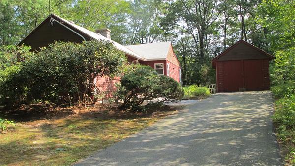 23 Patterson Road Lexington, MA 02421 - Photo 22 of 22 a front view of a house with a yard and garage