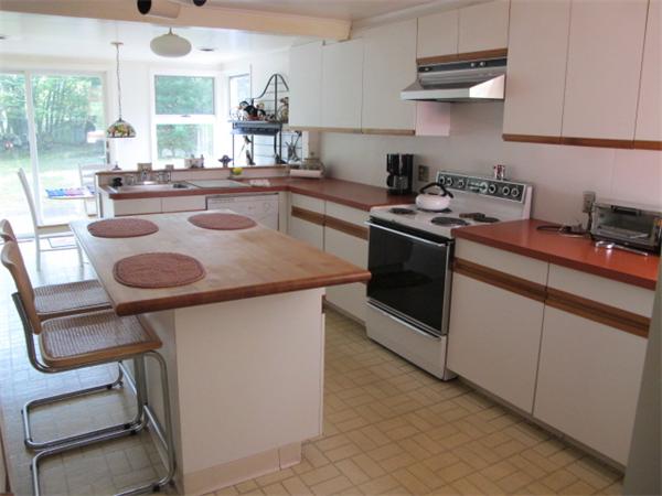 23 Patterson Road Lexington, MA 02421 - Photo 5 of 22 a kitchen with stainless steel appliances granite countertop a sink stove and cabinets