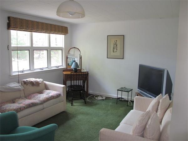 23 Patterson Road Lexington, MA 02421 - Photo 10 of 22 a living room with furniture and a flat screen tv