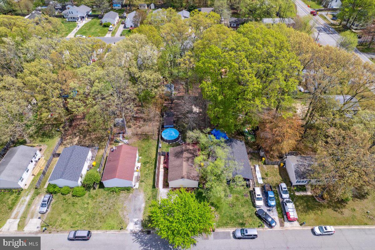 5519 Baskin Street Churchton, MD 20733 - Photo 12 of 20 an aerial view of residential house with outdoor space and trees all around