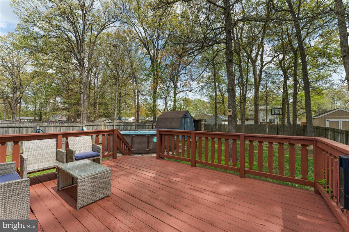 5519 Baskin Street Churchton, MD 20733 - Photo 14 of 20 a view of outdoor space with seating and trees