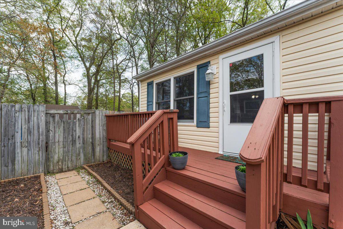 5519 Baskin Street Churchton, MD 20733 - Photo 16 of 20 a view of a deck with wooden floor and fence