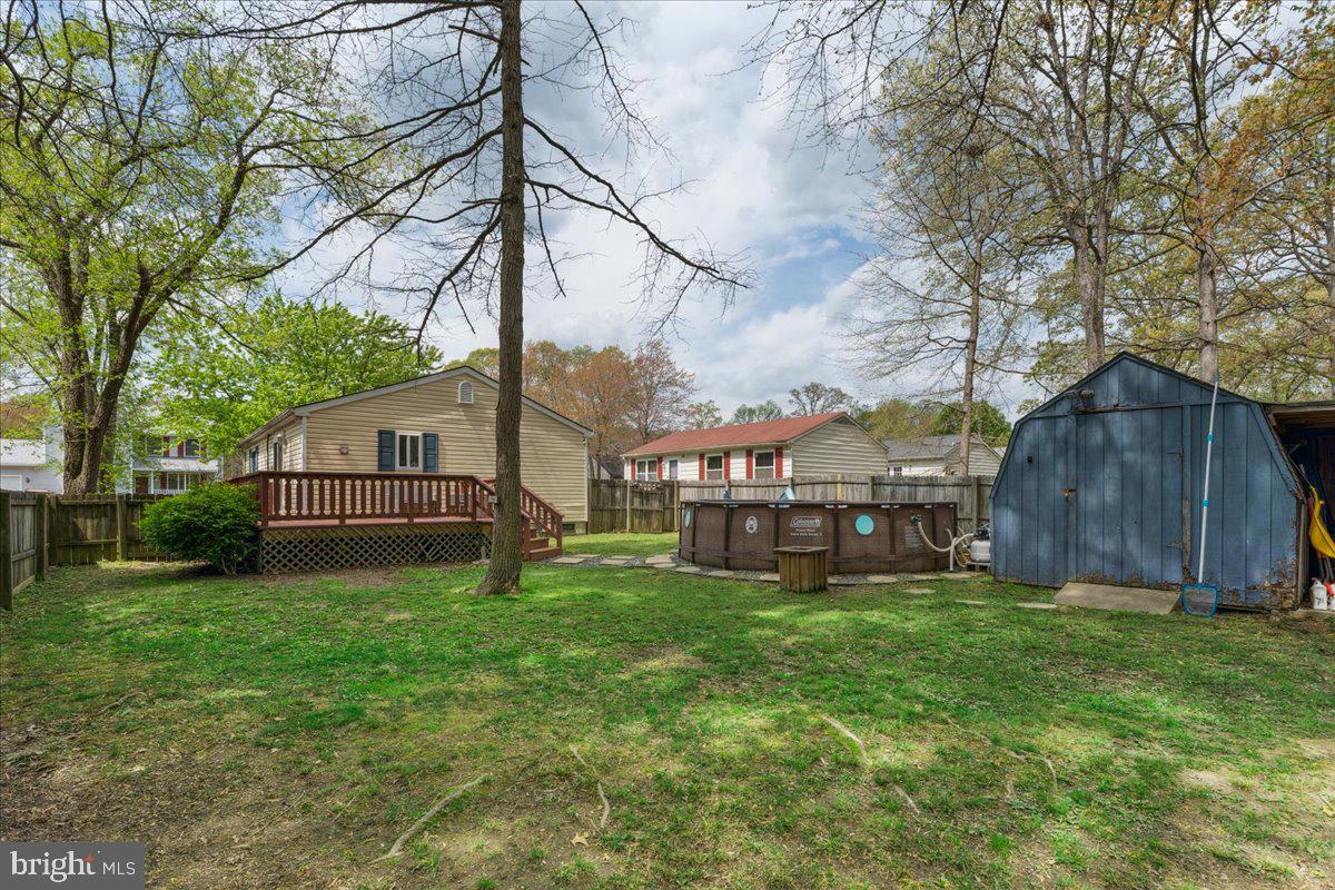 5519 Baskin Street Churchton, MD 20733 - Photo 17 of 20 a view of a house with a yard and sitting area