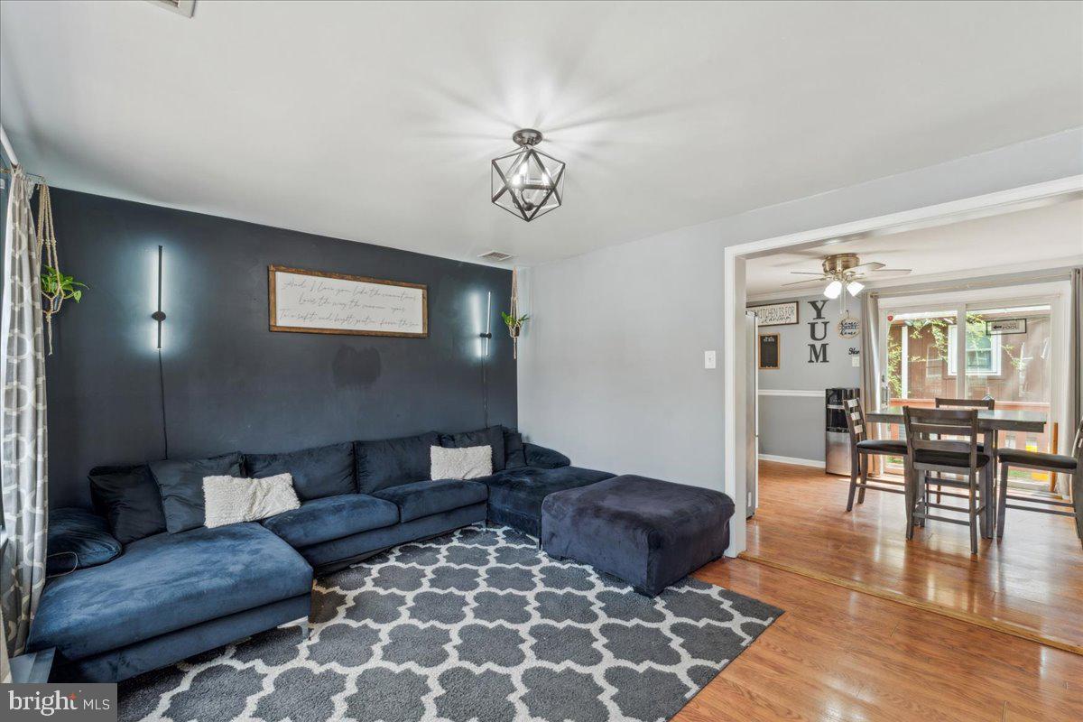5519 Baskin Street Churchton, MD 20733 - Photo 3 of 20 a living room with furniture and a table