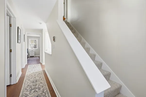 a view of a hallway with staircase