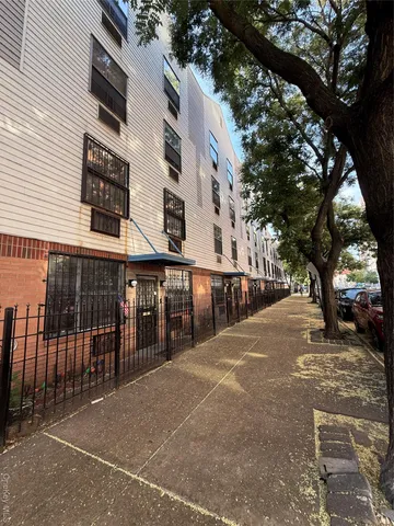 a view of a building with large trees