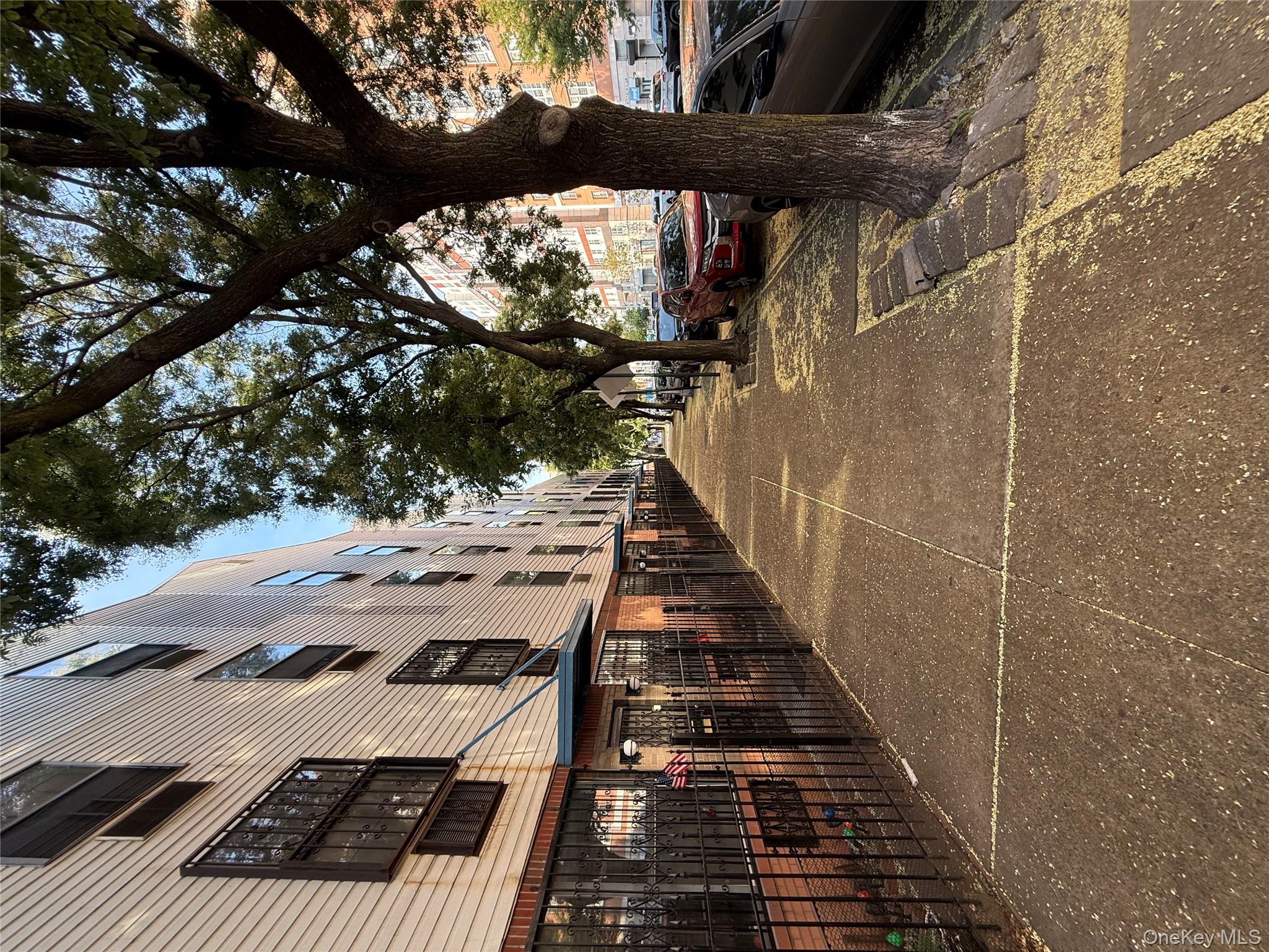 769 St Ann's Avenue, Unit B Bronx, NY 10456 - Photo 20 of 48 a view of a building with large trees