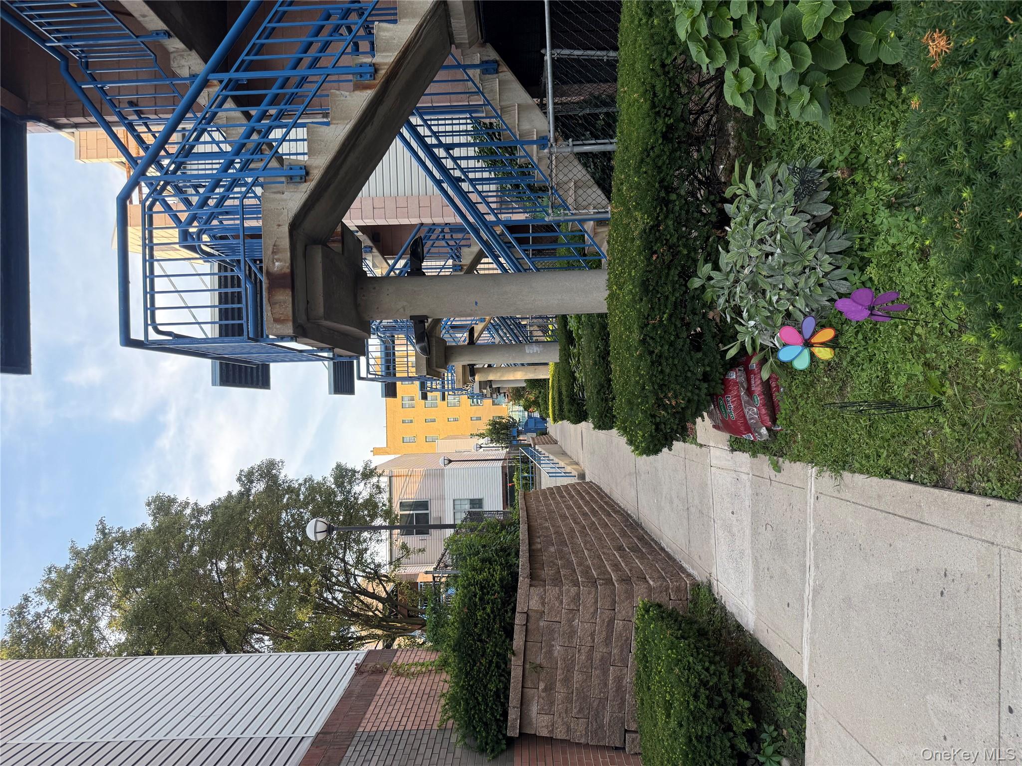 769 St Ann's Avenue, Unit B Bronx, NY 10456 - Photo 25 of 48 a view of a house with yard and plants