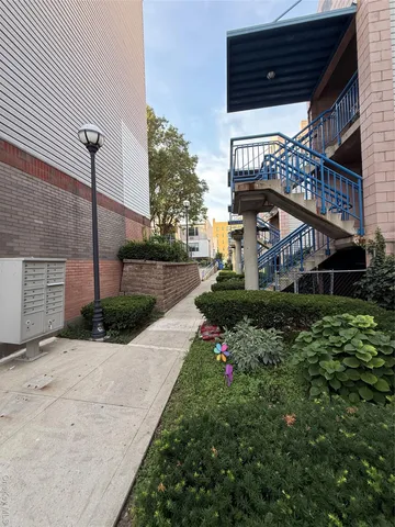 a view of a house with a large tree