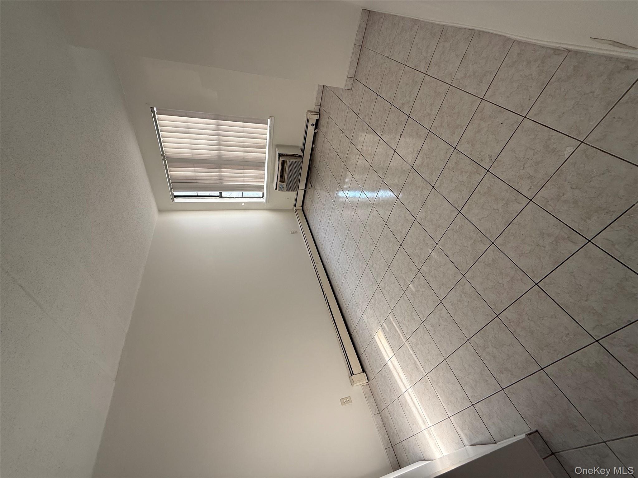 769 St Ann's Avenue, Unit B Bronx, NY 10456 - Photo 34 of 48 an empty room with windows