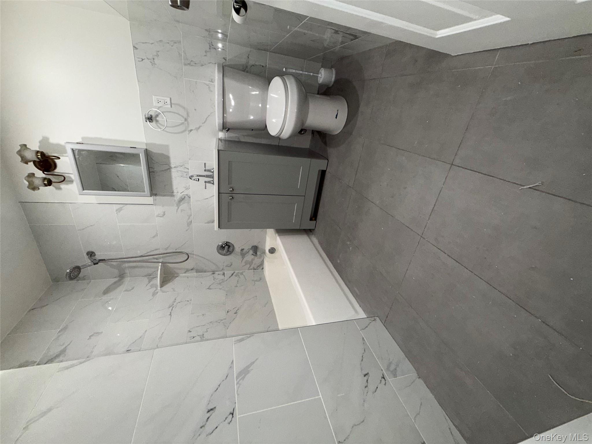 769 St Ann's Avenue, Unit B Bronx, NY 10456 - Photo 35 of 48 a bathroom with a sink a toilet and bathtub