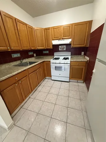 a bathroom with a sink a toilet and bathtub