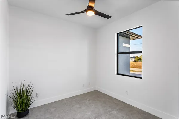 a kitchen with stainless steel appliances kitchen island granite countertop a stove a sink and a refrigerator