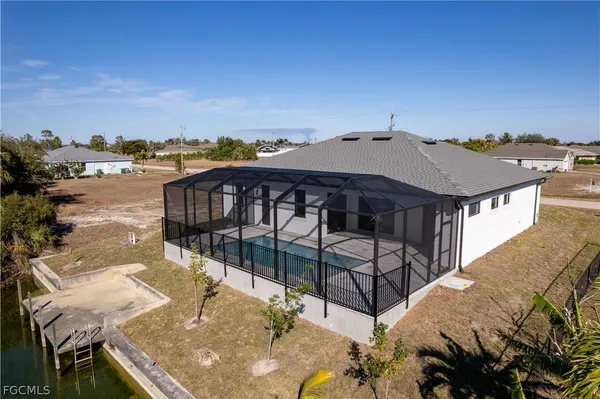 an aerial view of houses with outdoor space