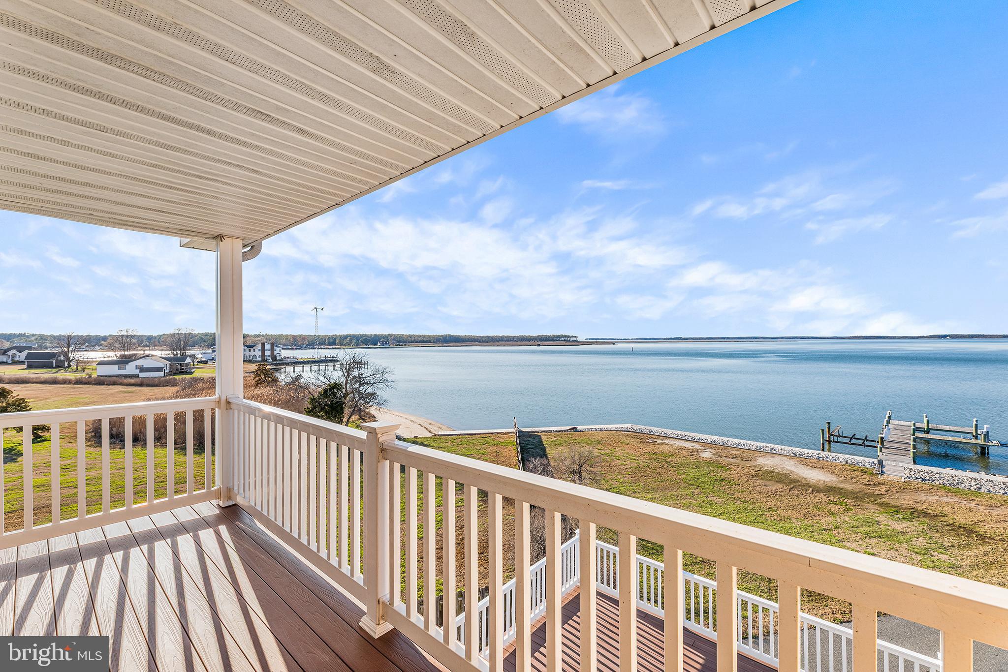 1252 Old Madison Road Madison, MD 21648 - Photo 36 of 55 a view of a balcony with wooden floor and lake view