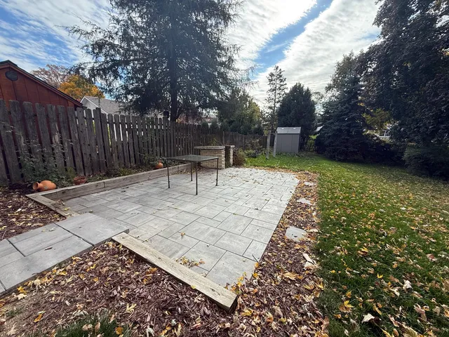 a view of a bench in a backyard
