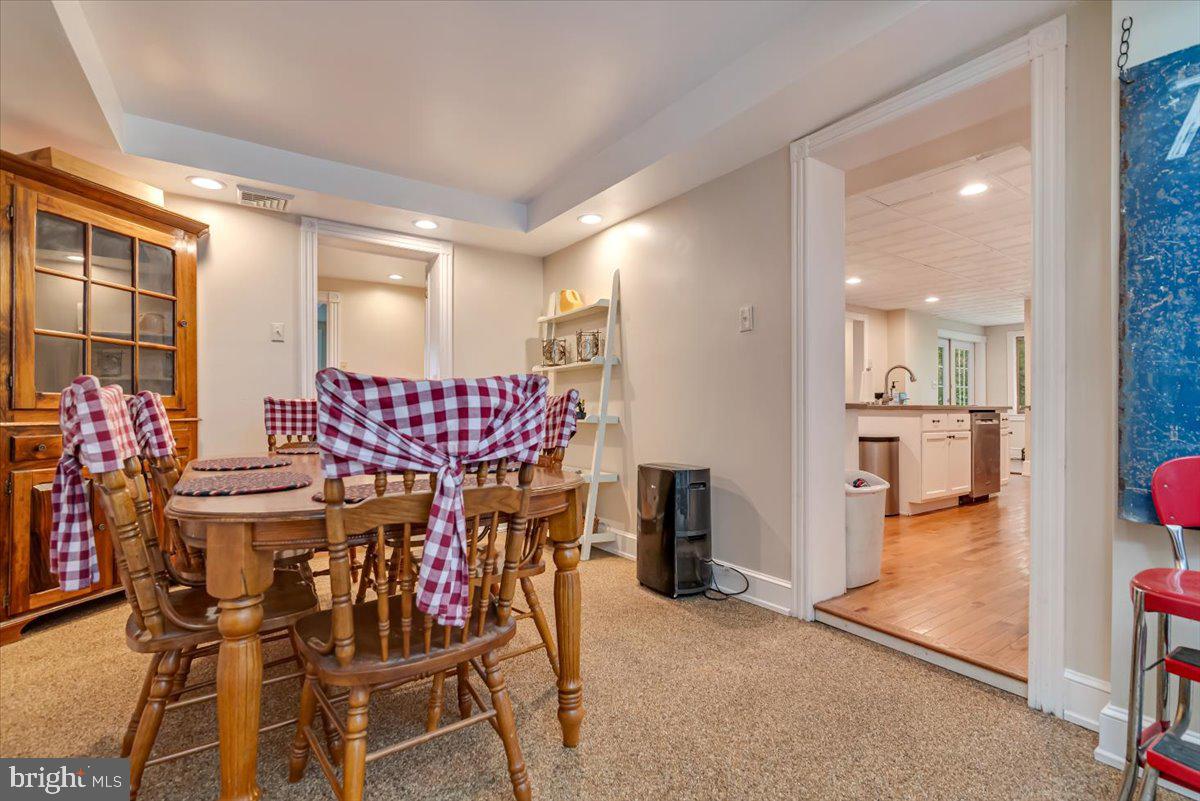 3585 Fairyland Road Lehighton, PA 18235 - Photo 24 of 109 a view of a dining room with furniture and a chandelier