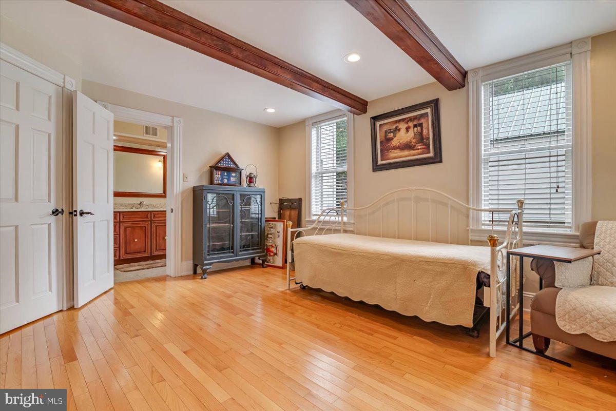 3585 Fairyland Road Lehighton, PA 18235 - Photo 32 of 109 a spacious bedroom with a bed and a flat screen tv