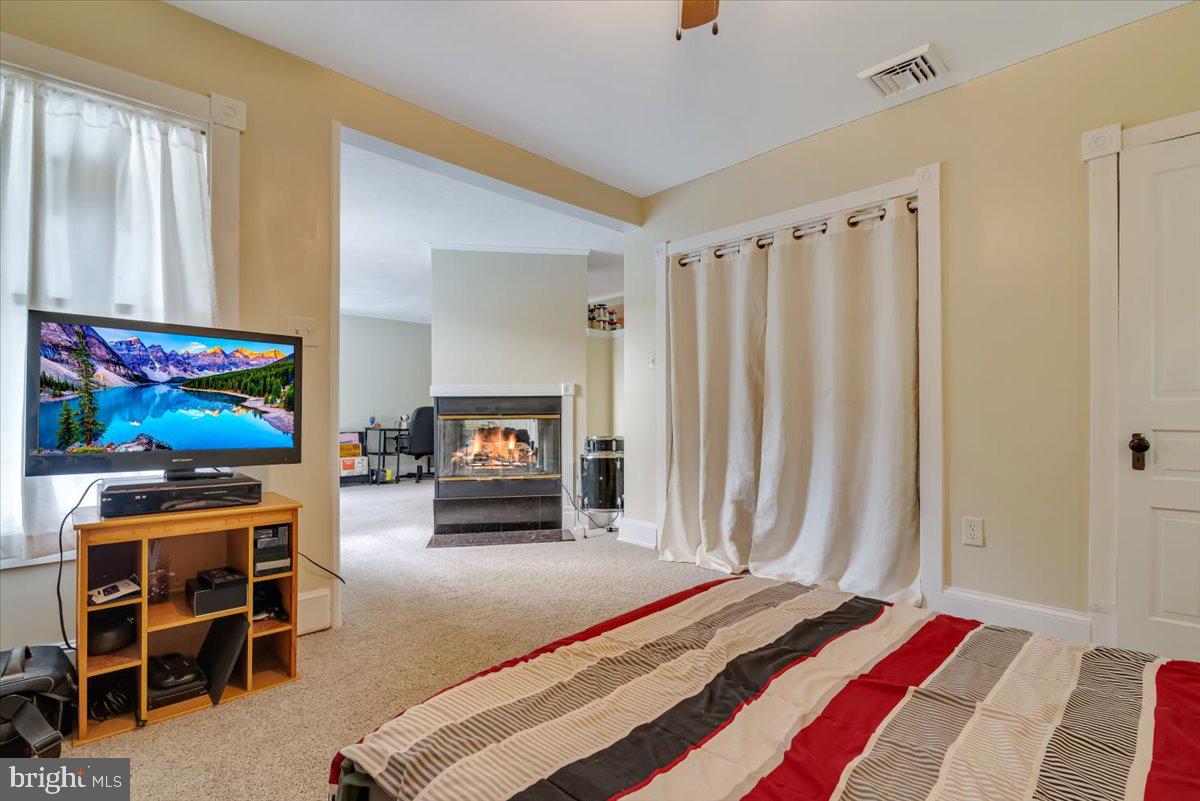 3585 Fairyland Road Lehighton, PA 18235 - Photo 50 of 109 a bedroom with furniture and a flat screen tv