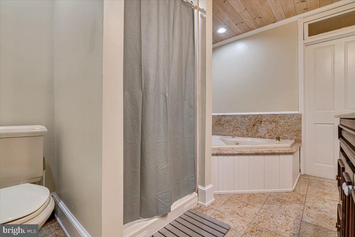 3585 Fairyland Road Lehighton, PA 18235 - Photo 55 of 109 a bathroom with a granite countertop sink and a toilet