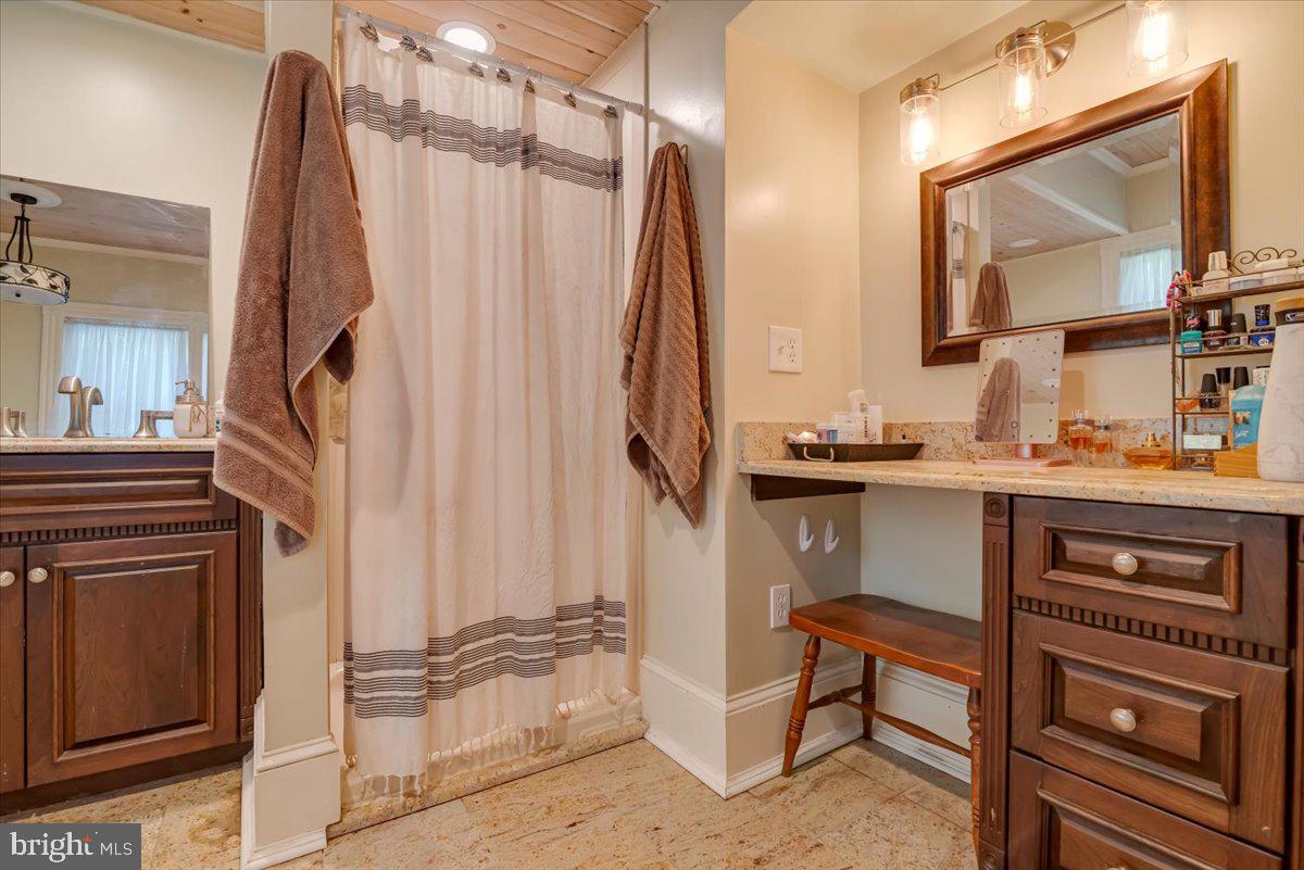 3585 Fairyland Road Lehighton, PA 18235 - Photo 62 of 109 a bathroom with a sink a mirror and a shower