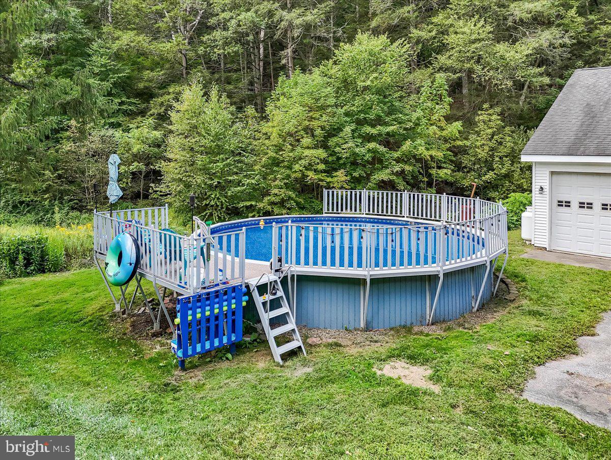 3585 Fairyland Road Lehighton, PA 18235 - Photo 73 of 109 a view of a deck with a table and chairs with wooden fence