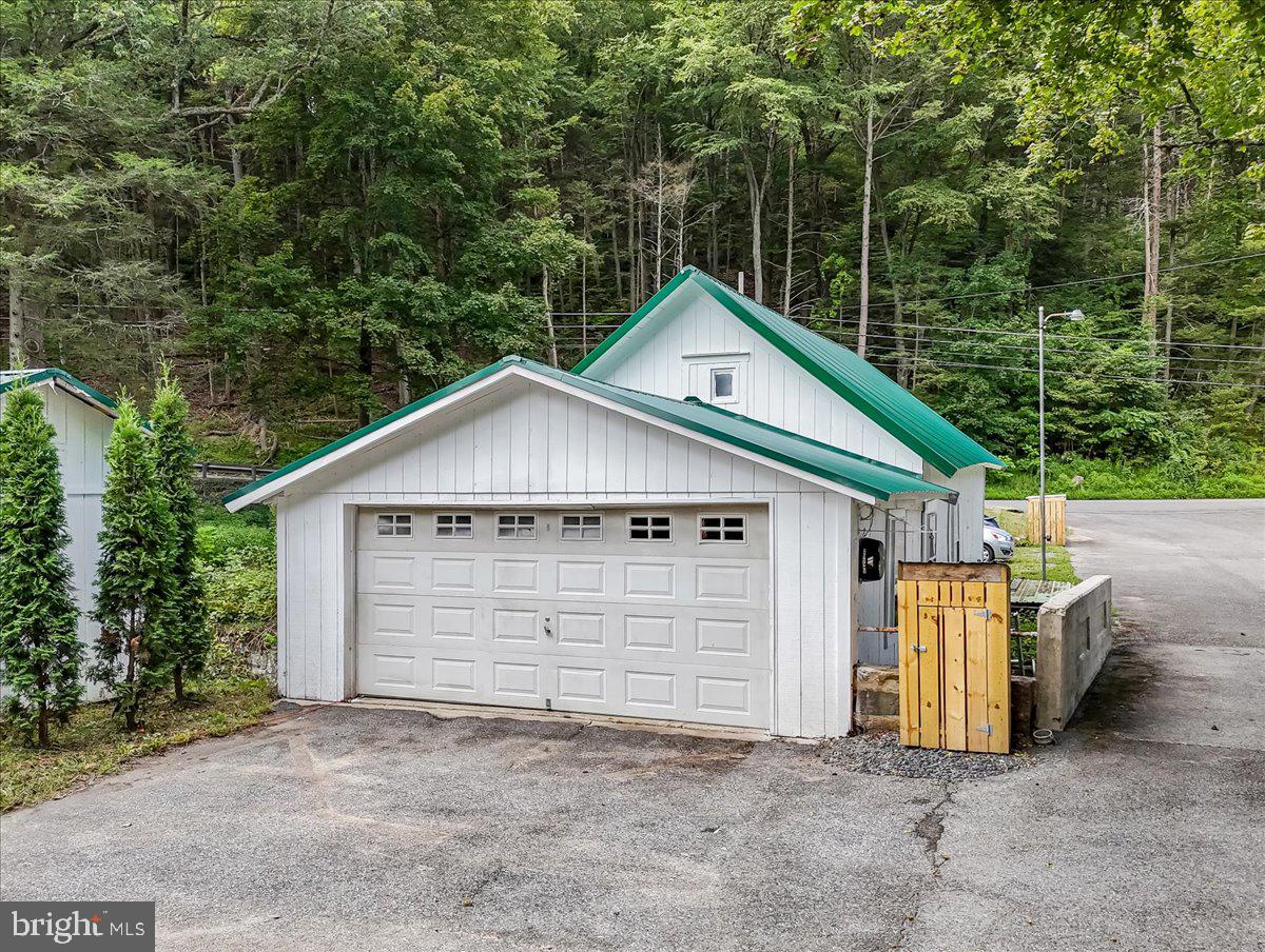 3585 Fairyland Road Lehighton, PA 18235 - Photo 78 of 109 a view of a small house with a small yard and large tree