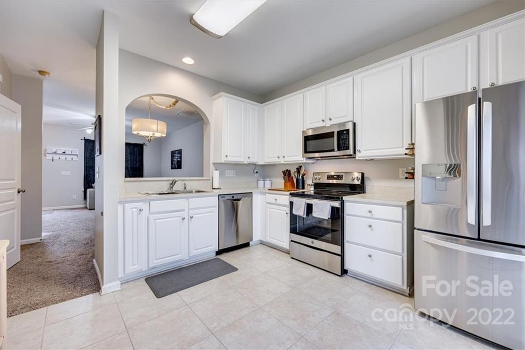 931 Copperstone Lane Fort Mill, SC 29708 - Photo 12 of 30 a kitchen with a refrigerator stove and microwave