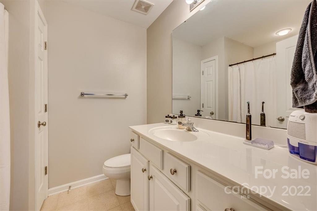 931 Copperstone Lane Fort Mill, SC 29708 - Photo 24 of 30 a bathroom with a double vanity sink toilet and mirror