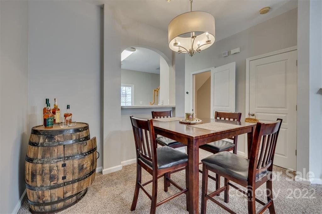 931 Copperstone Lane Fort Mill, SC 29708 - Photo 10 of 30 a view of a dining room with furniture and chandelier