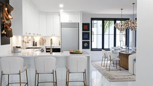 a dining room with furniture a large window and a chandelier